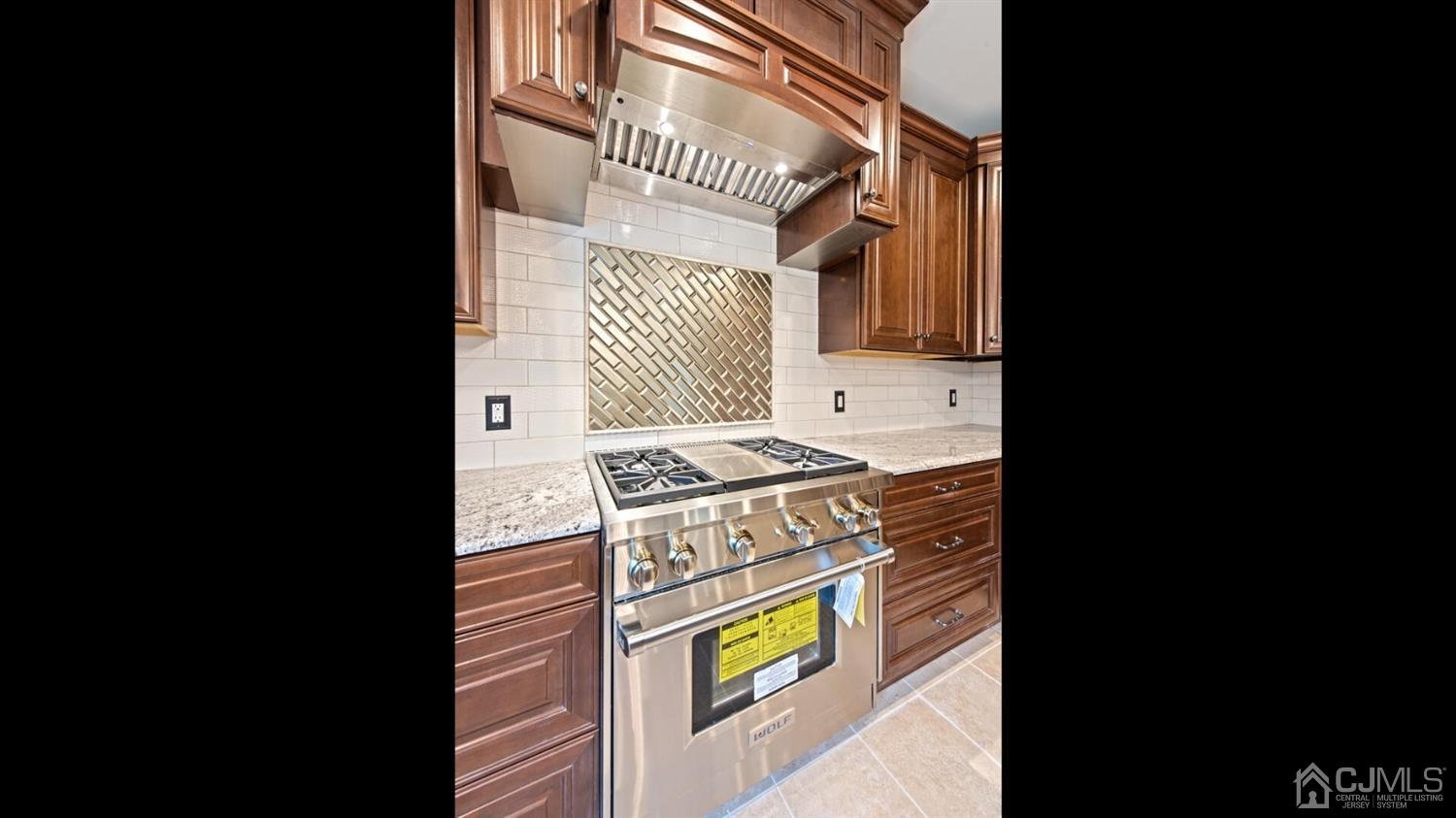 152 Culver Road Monmouth Junction, NJ 08852 - Photo 25 of 87 a kitchen with a stove and a microwave