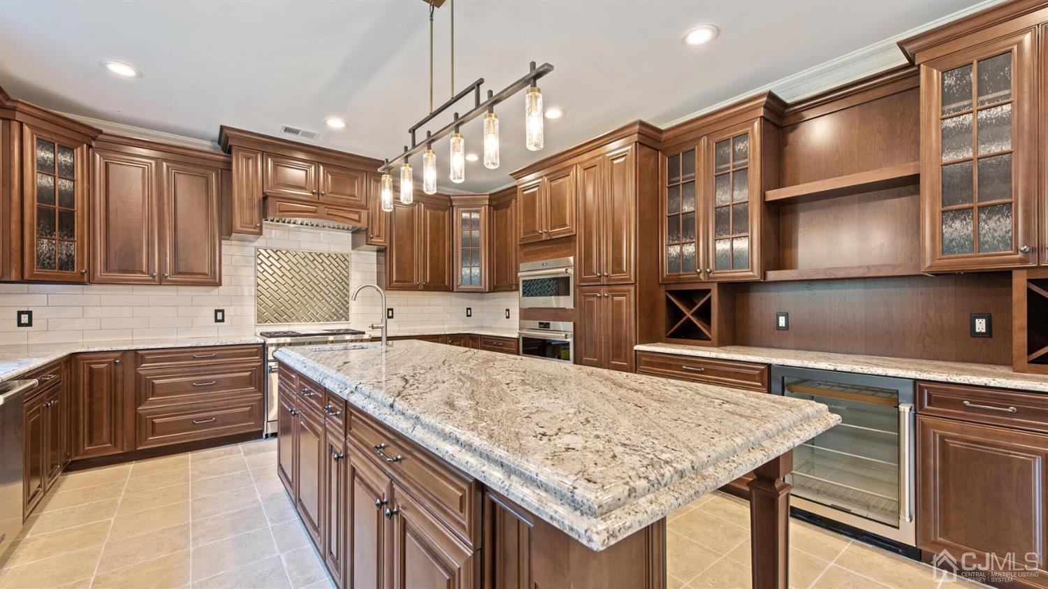 152 Culver Road Monmouth Junction, NJ 08852 - Photo 27 of 87 a kitchen with stainless steel appliances granite countertop a sink and a refrigerator