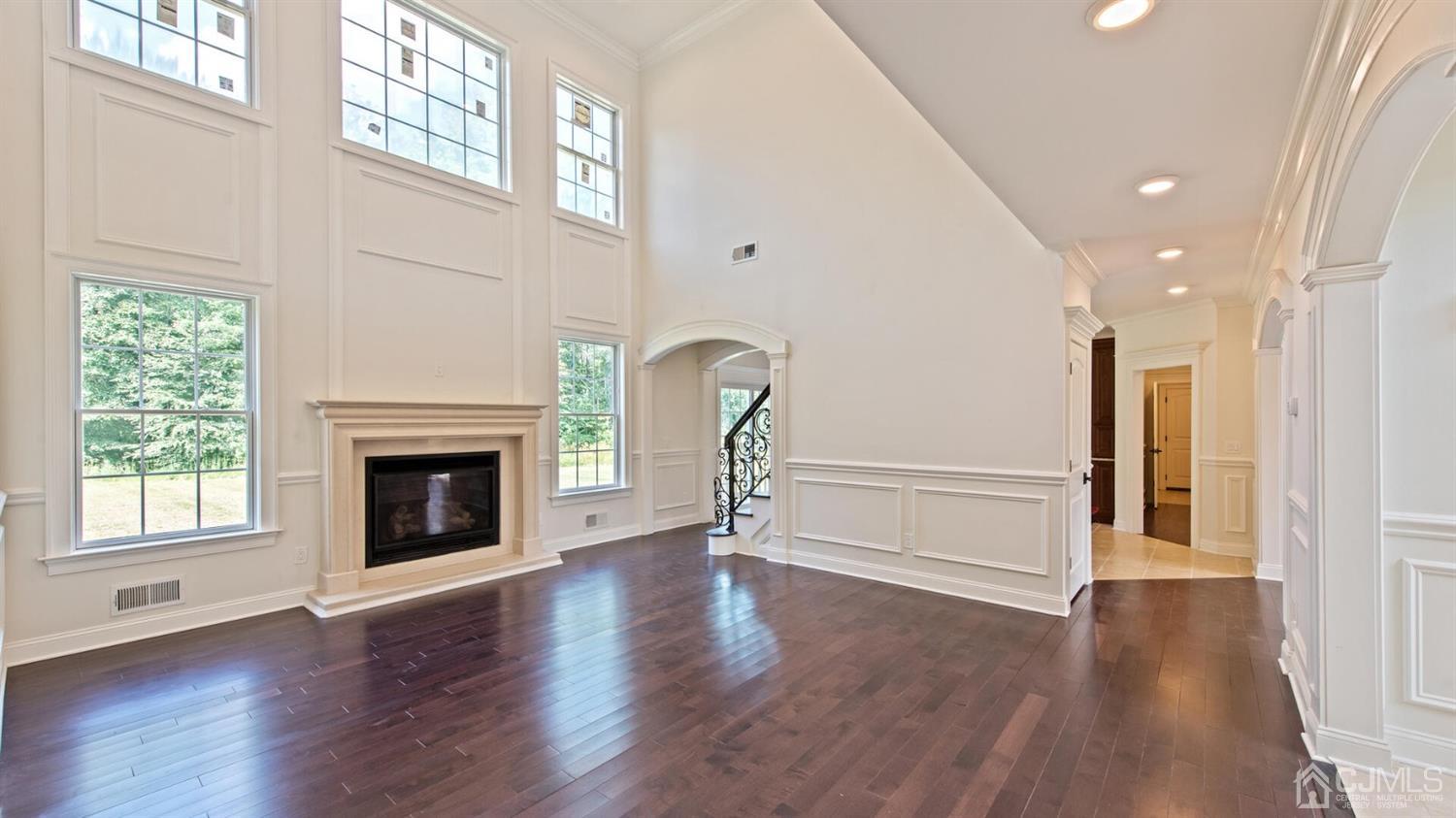 152 Culver Road Monmouth Junction, NJ 08852 - Photo 34 of 87 Two story family room with a gas fireplace, recessed lighting & easy entry to the back staircase