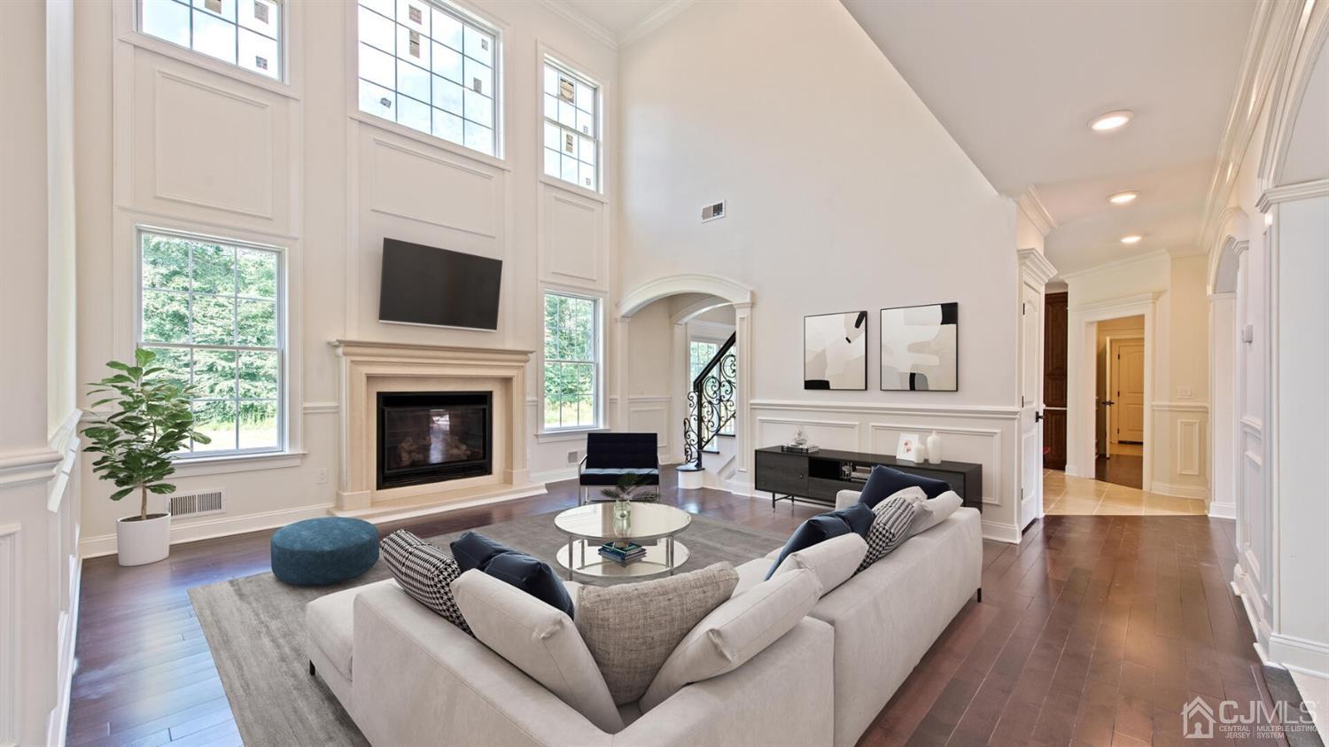 152 Culver Road Monmouth Junction, NJ 08852 - Photo 36 of 87 a living room with furniture a fireplace a flat screen tv and a large window