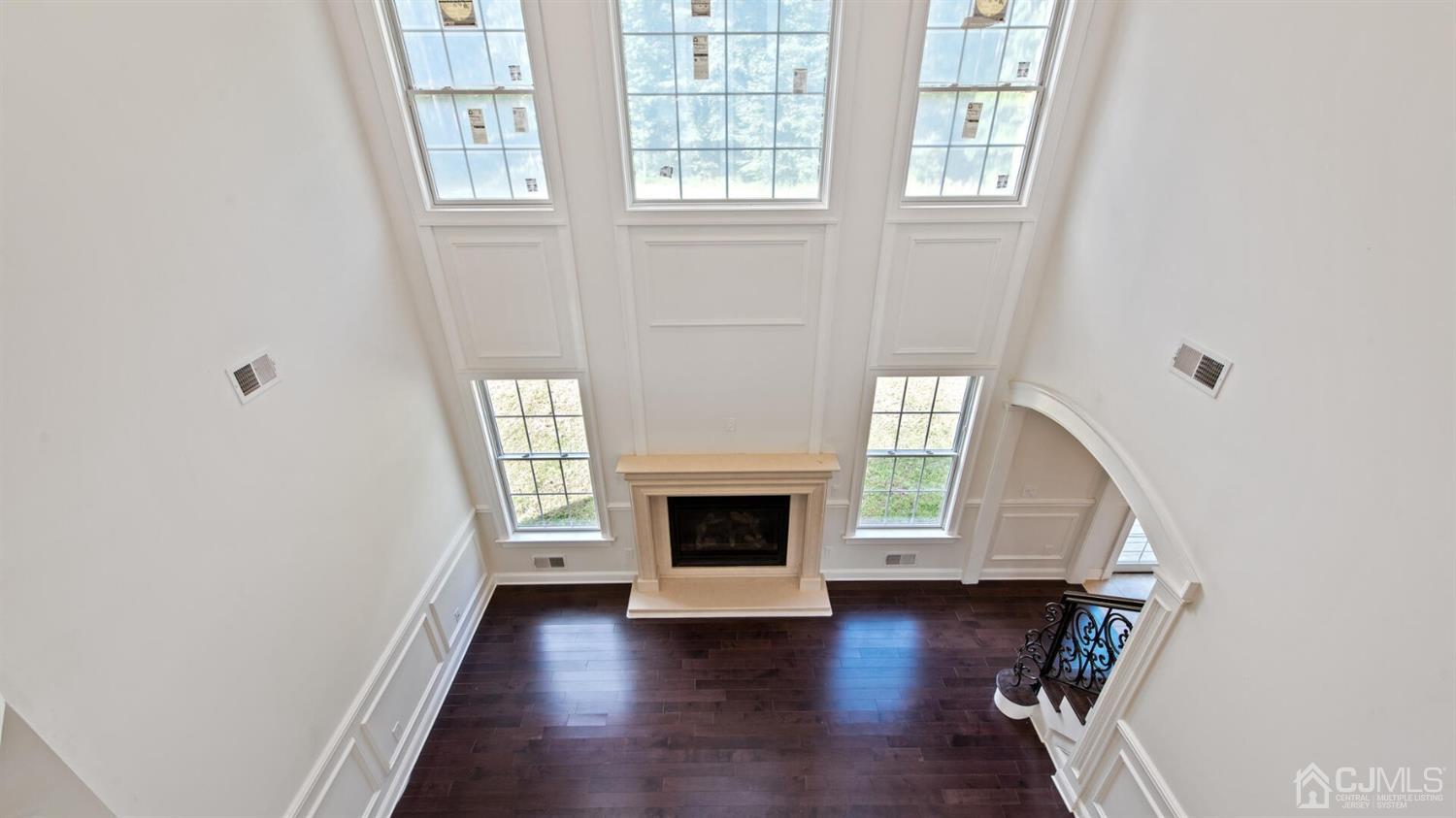 152 Culver Road Monmouth Junction, NJ 08852 - Photo 46 of 87 an empty room with wooden floor fireplace and windows