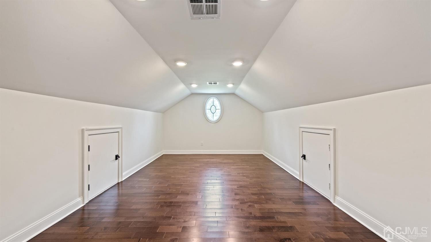 152 Culver Road Monmouth Junction, NJ 08852 - Photo 54 of 87 a view of an empty room with wooden floor and a window
