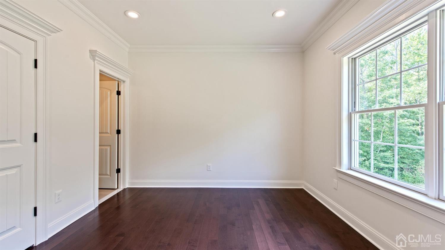 152 Culver Road Monmouth Junction, NJ 08852 - Photo 60 of 87 an empty room with wooden floor and a window