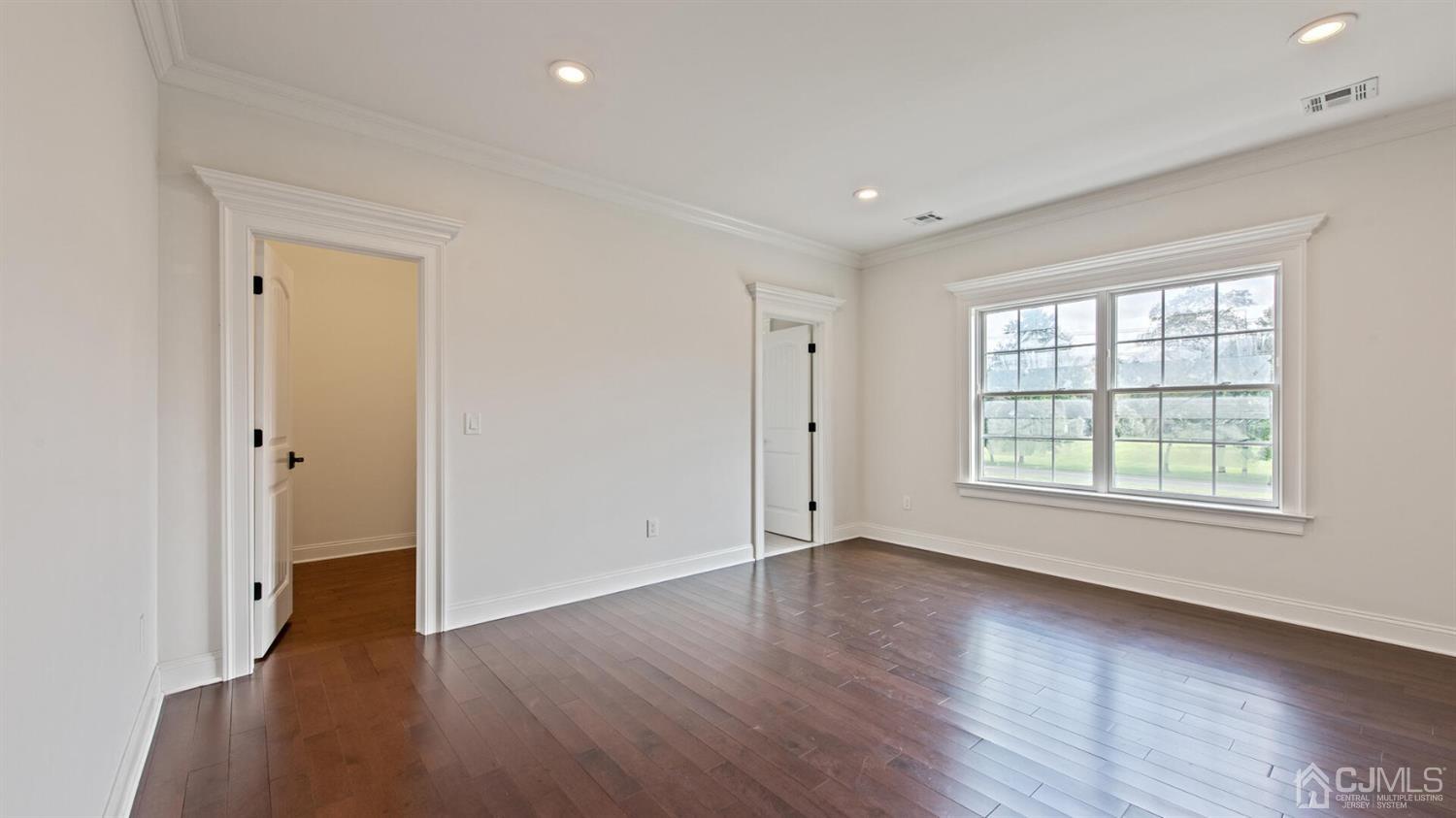 152 Culver Road Monmouth Junction, NJ 08852 - Photo 61 of 87 an empty room with wooden floor and windows