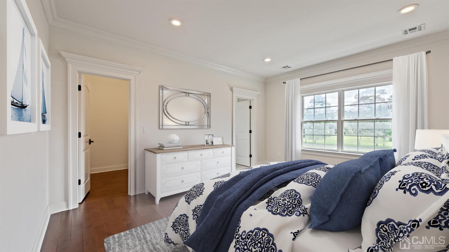 152 Culver Road Monmouth Junction, NJ 08852 - Photo 62 of 87 a spacious bedroom with a bed a dresser and wooden floor