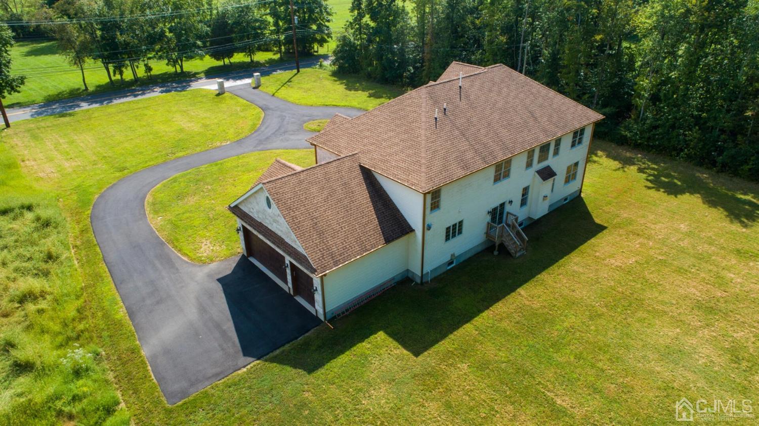 152 Culver Road Monmouth Junction, NJ 08852 - Photo 71 of 87 a aerial view of a house with swimming pool and large trees
