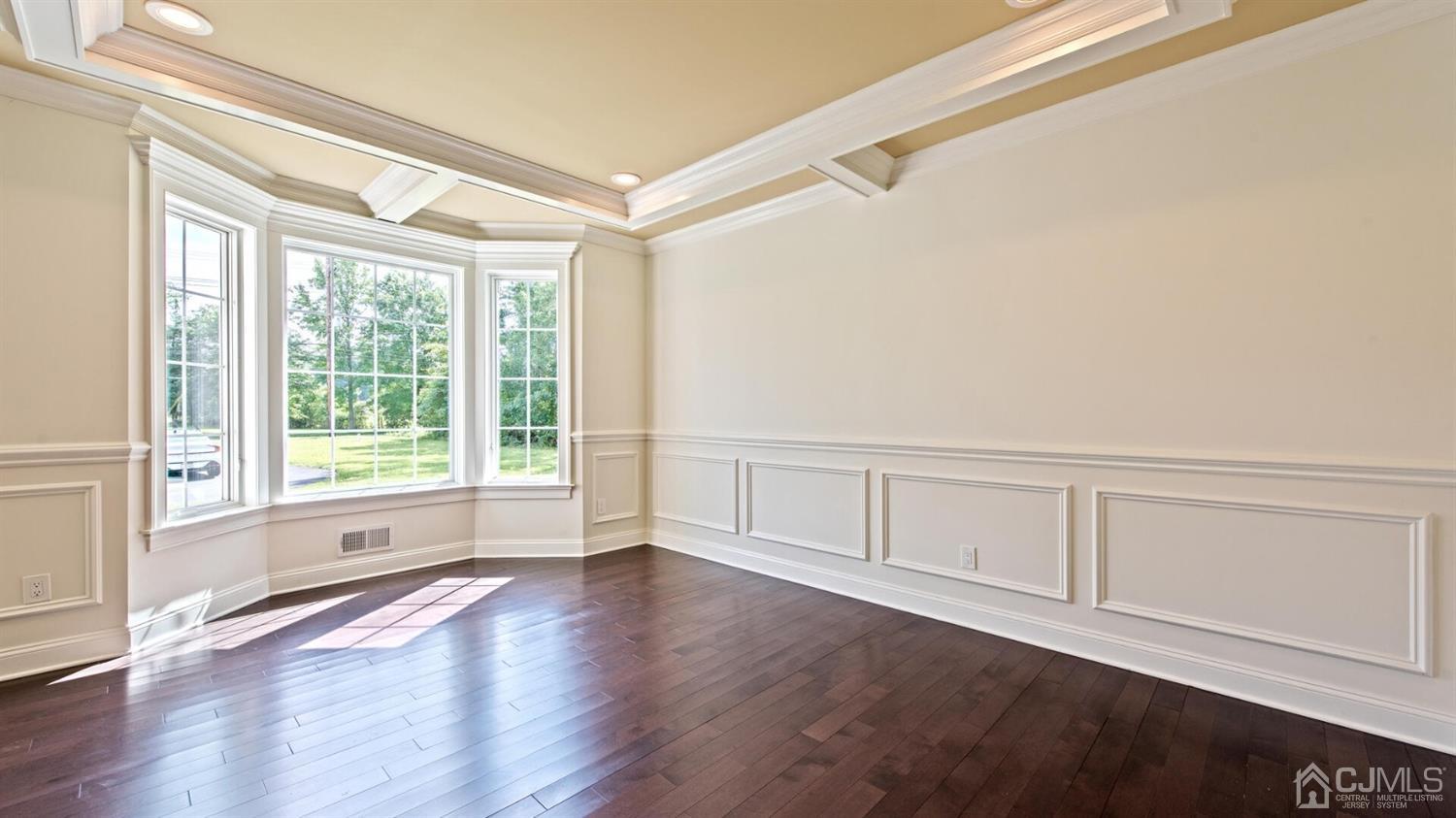 152 Culver Road Monmouth Junction, NJ 08852 - Photo 8 of 87 a view of an empty room with wooden floor and a window