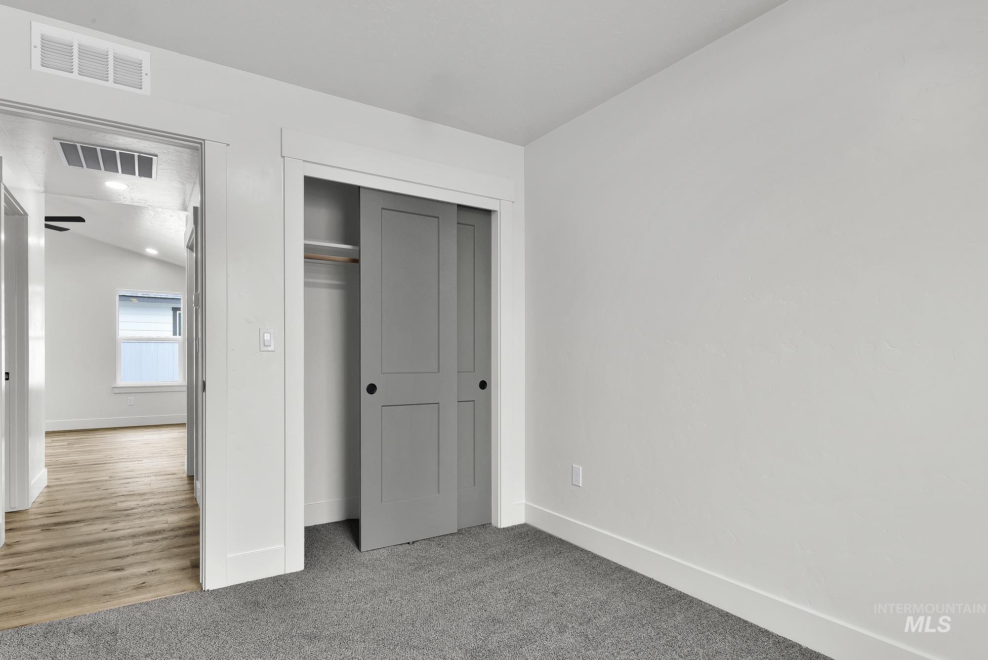 323 North 12th Street Parma, ID 83660 - Photo 23 of 28 Unfurnished bedroom featuring a closet and light carpet
