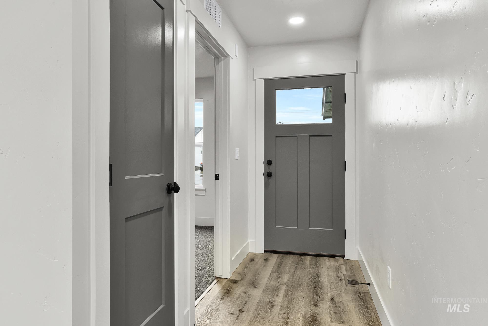 323 North 12th Street Parma, ID 83660 - Photo 3 of 28 Doorway to outside with wood finished floors and recessed lighting