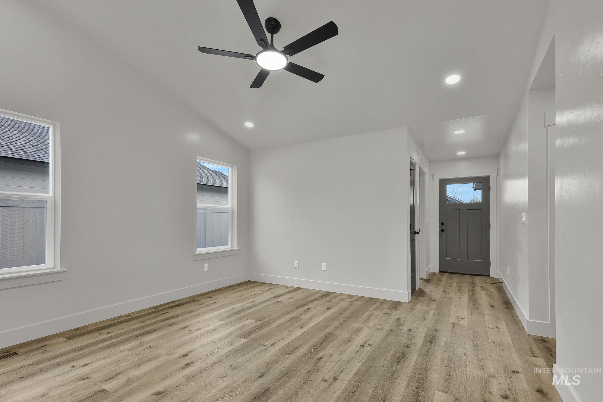 323 North 12th Street Parma, ID 83660 - Photo 5 of 28 Entrance foyer featuring light wood-type flooring, ceiling fan, plenty of natural light, recessed lighting, and lofted ceiling