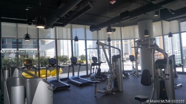55 Southwest 9th Street, Unit 3307 Miami, FL 33130 - Photo 11 of 16 a view of a room with gym equipment