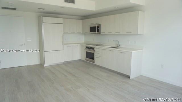 55 Southwest 9th Street, Unit 3307 Miami, FL 33130 - Photo 3 of 16 a view of a kitchen with electric appliances