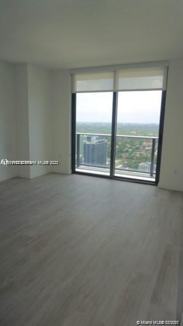 55 Southwest 9th Street, Unit 3307 Miami, FL 33130 - Photo 5 of 16 a view of an empty room with a window