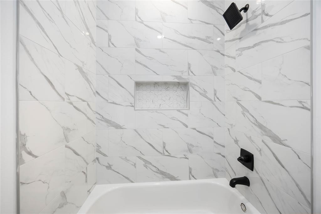 8019 Cora Street, Unit A Houston, TX 77088 - Photo 20 of 25 a bathroom with a bathtub