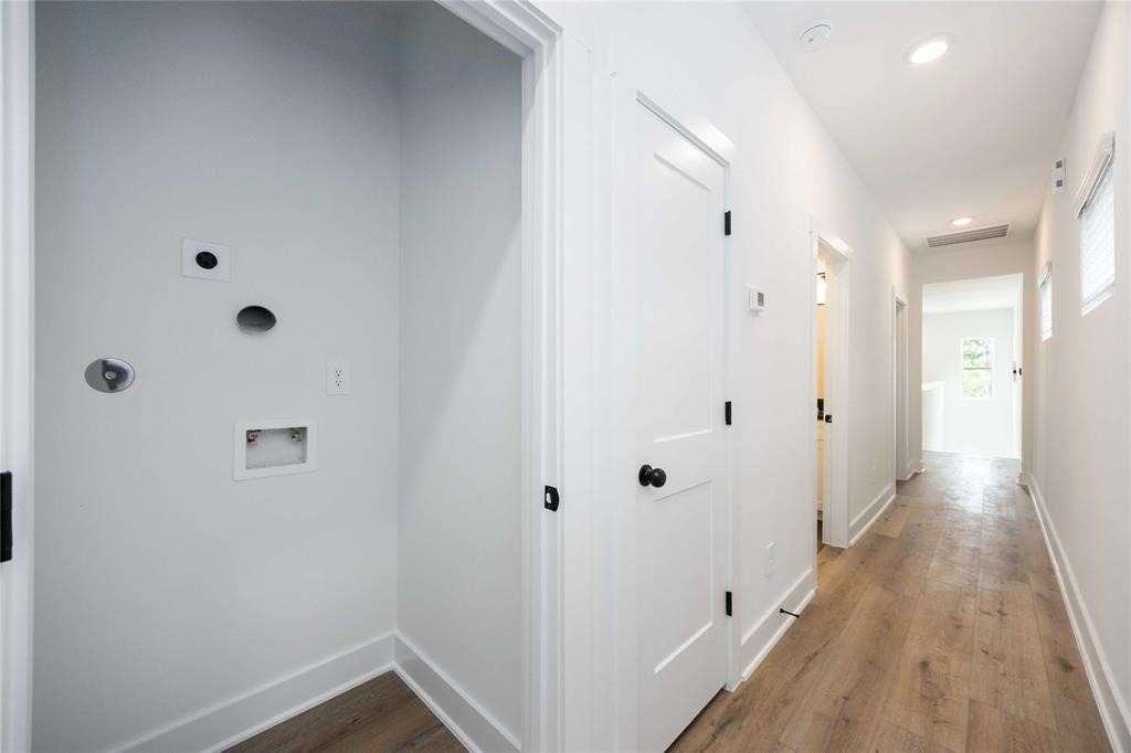 8019 Cora Street, Unit A Houston, TX 77088 - Photo 10 of 25 a view of a hallway with wooden floor
