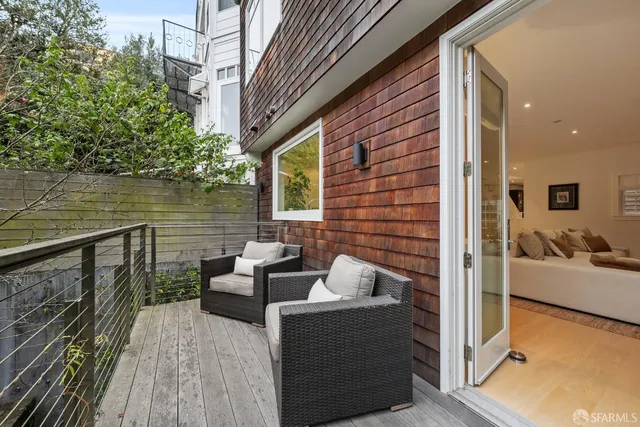 a living room with furniture and windows