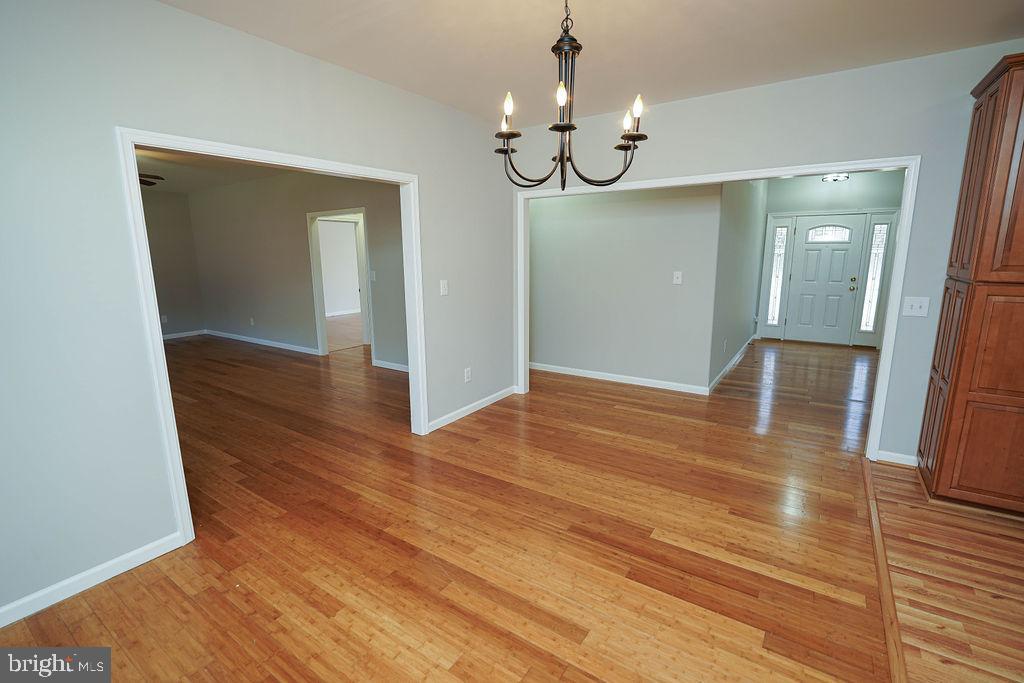 30980 Rehobeth Road Westover, MD 21871 - Photo 12 of 36 a view of livingroom with chandelier and wooden floor