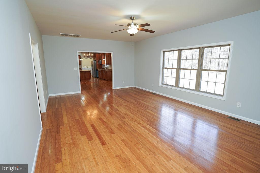30980 Rehobeth Road Westover, MD 21871 - Photo 15 of 36 a view of an empty room with wooden floor and a window