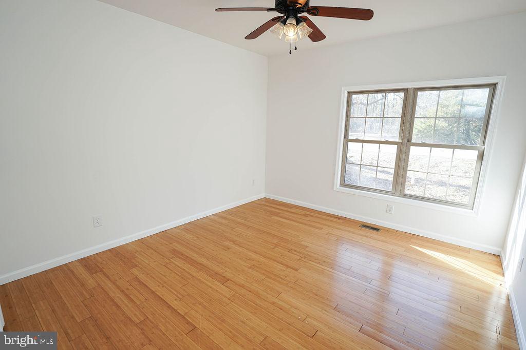 30980 Rehobeth Road Westover, MD 21871 - Photo 17 of 36 wooden floor in an empty room with a window