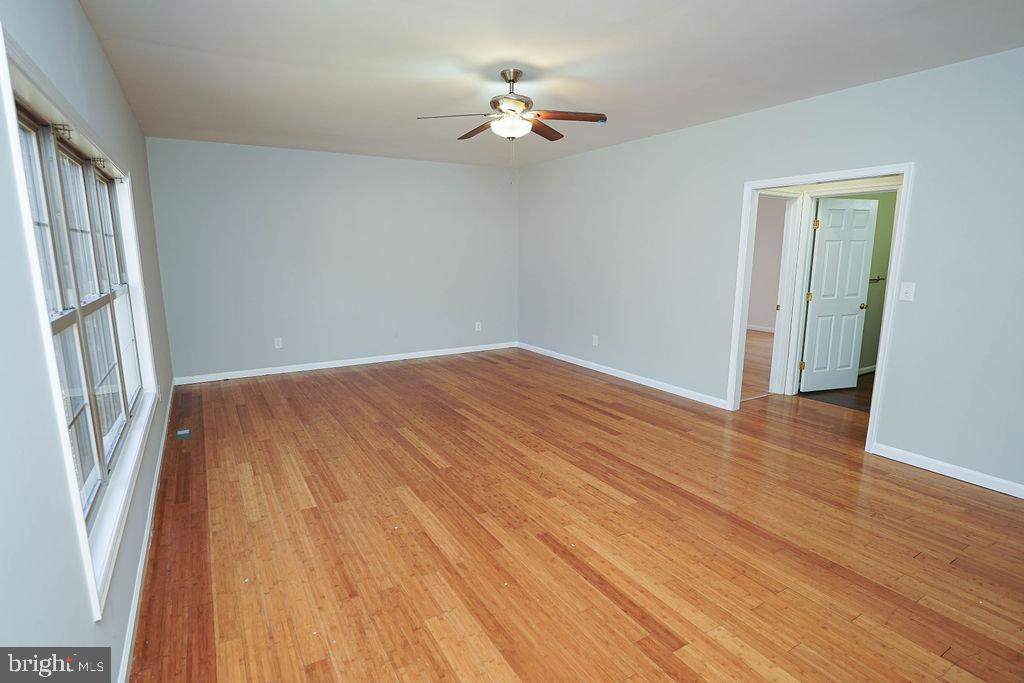 30980 Rehobeth Road Westover, MD 21871 - Photo 19 of 36 wooden floor in an empty room with a window