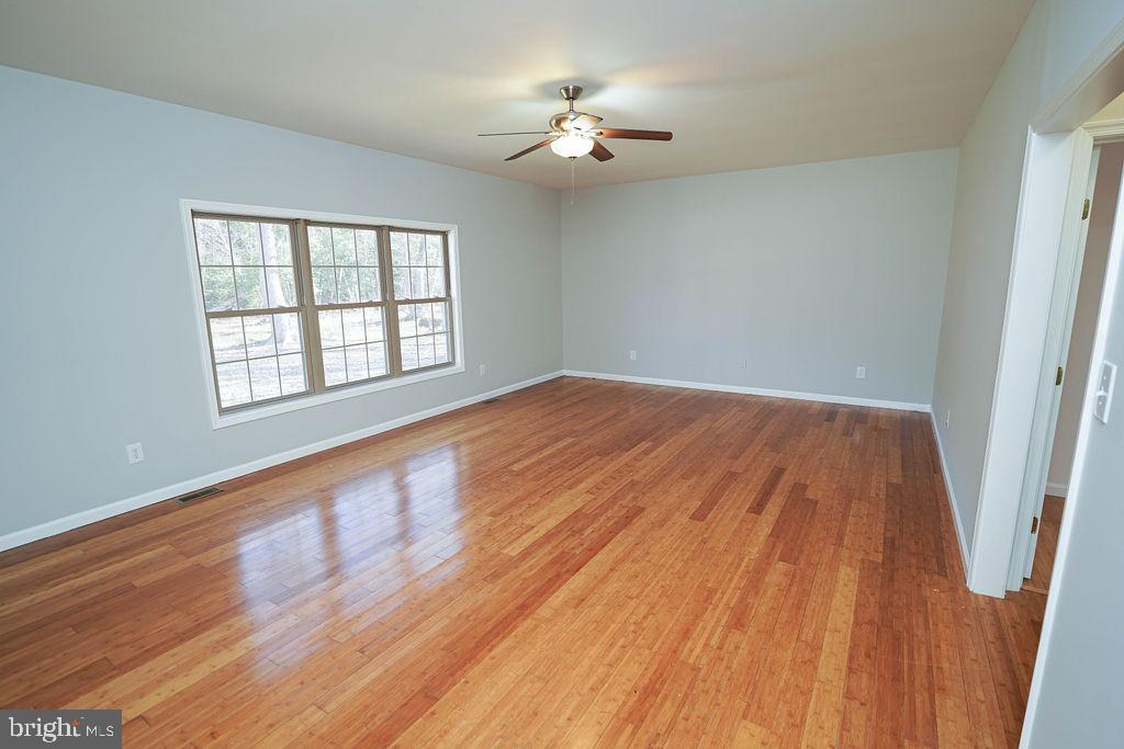 30980 Rehobeth Road Westover, MD 21871 - Photo 20 of 36 wooden floor in an empty room with a window