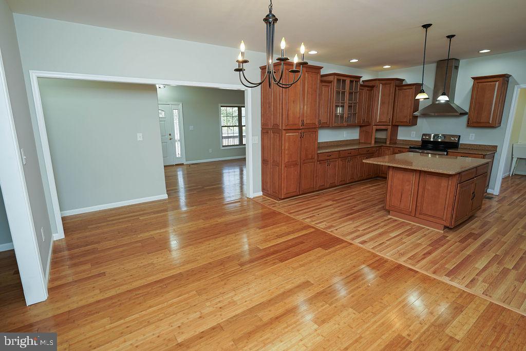 30980 Rehobeth Road Westover, MD 21871 - Photo 7 of 36 a large kitchen with granite countertop a large counter top appliances and cabinets