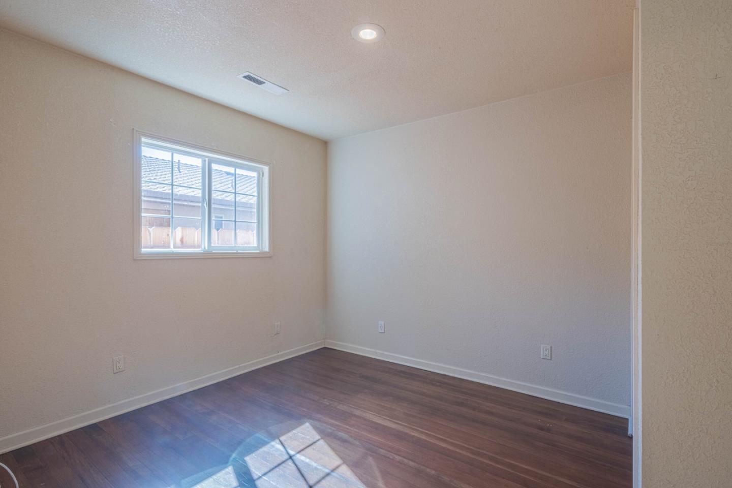 40 Oak Street Salinas, CA 93901 - Photo 22 of 28 an empty room with wooden floor and windows