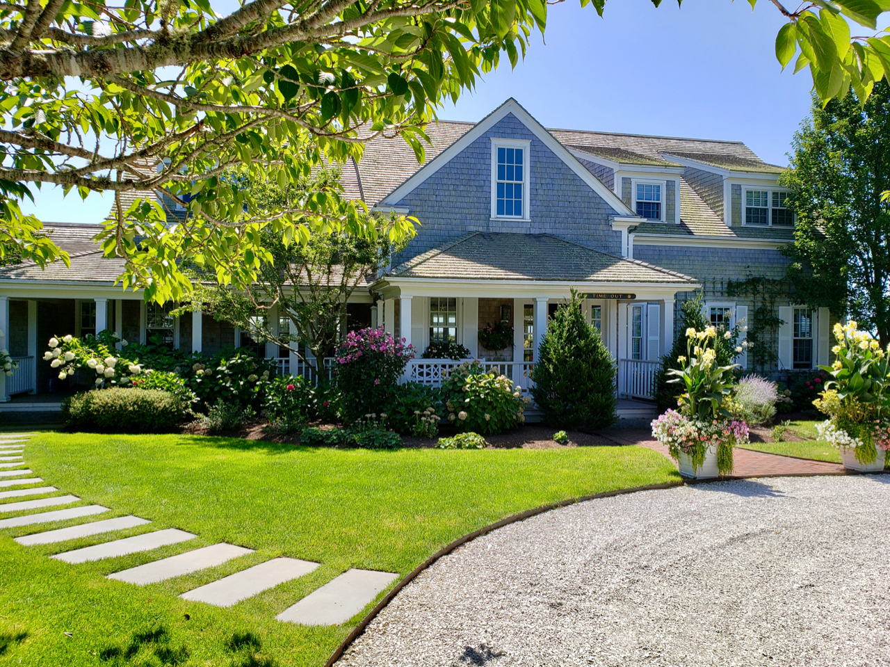 42 Main Street Nantucket, MA 02554 - Photo 1 of 4 a front view of a house with a yard