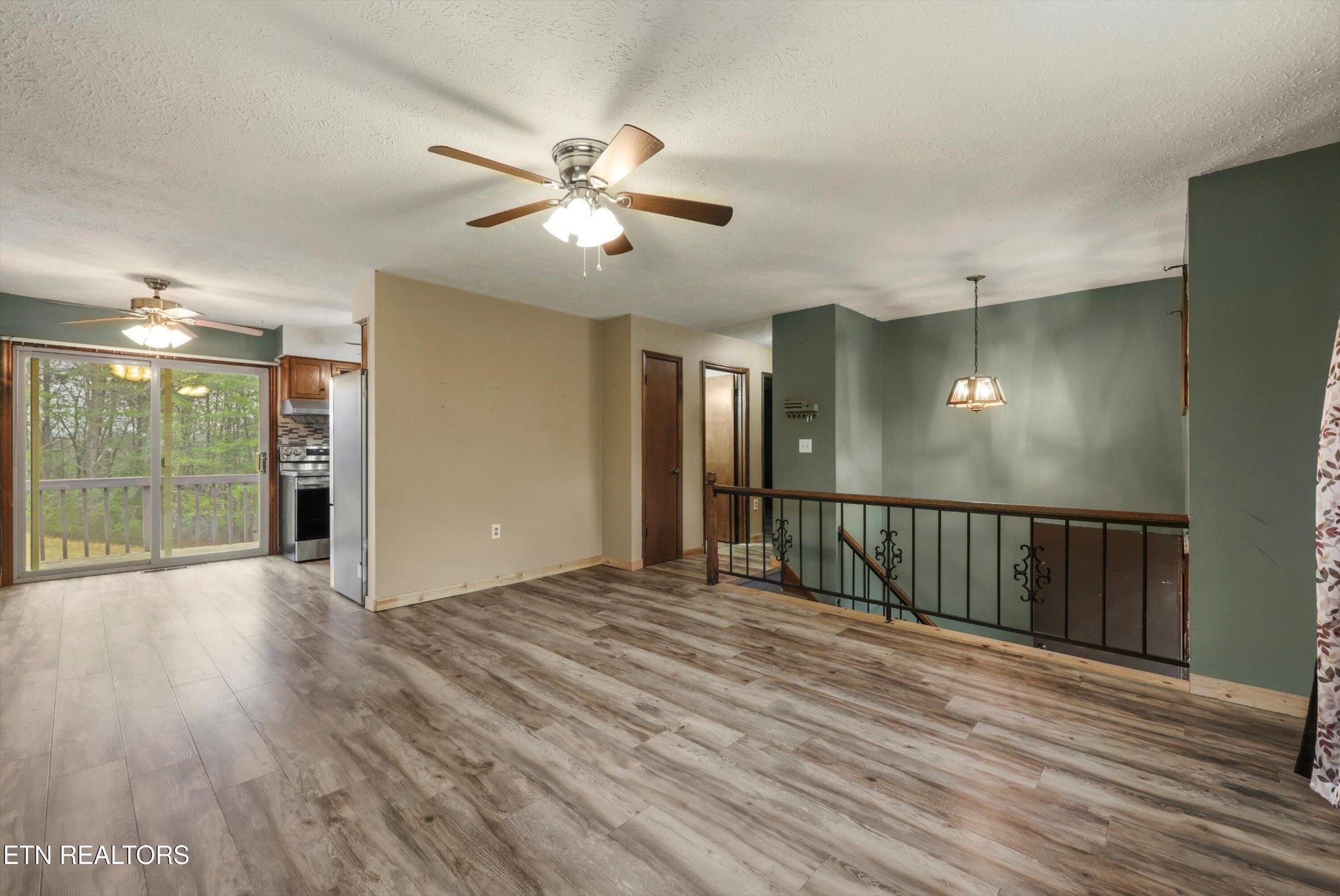 47 Paint Rock Ferry Road Kingston, TN 37763 - Photo 5 of 38 a view of a livingroom with a hall and wooden floor
