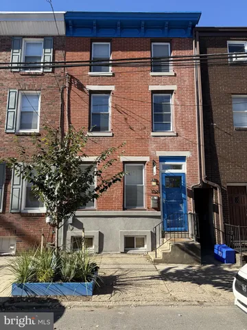 a front view of a building with street view