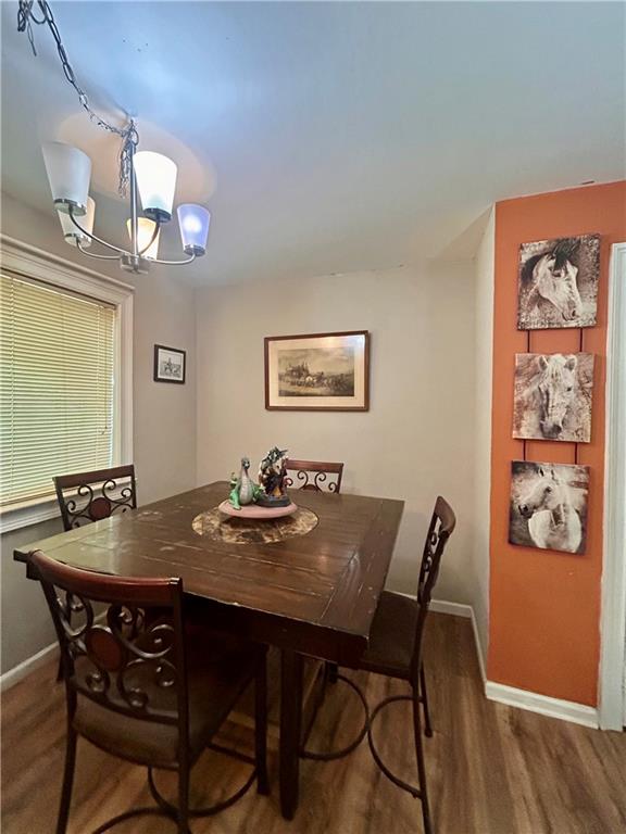 27 Hawks Trail Newborn, GA 30056 - Photo 11 of 33 a view of a dining room with furniture and wooden floor