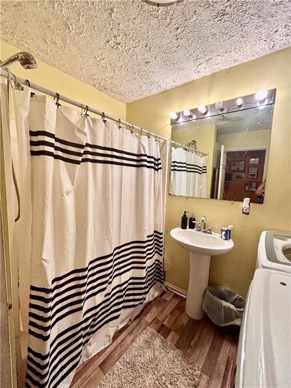 27 Hawks Trail Newborn, GA 30056 - Photo 13 of 33 a bathroom with a sink a toilet a mirror and shower