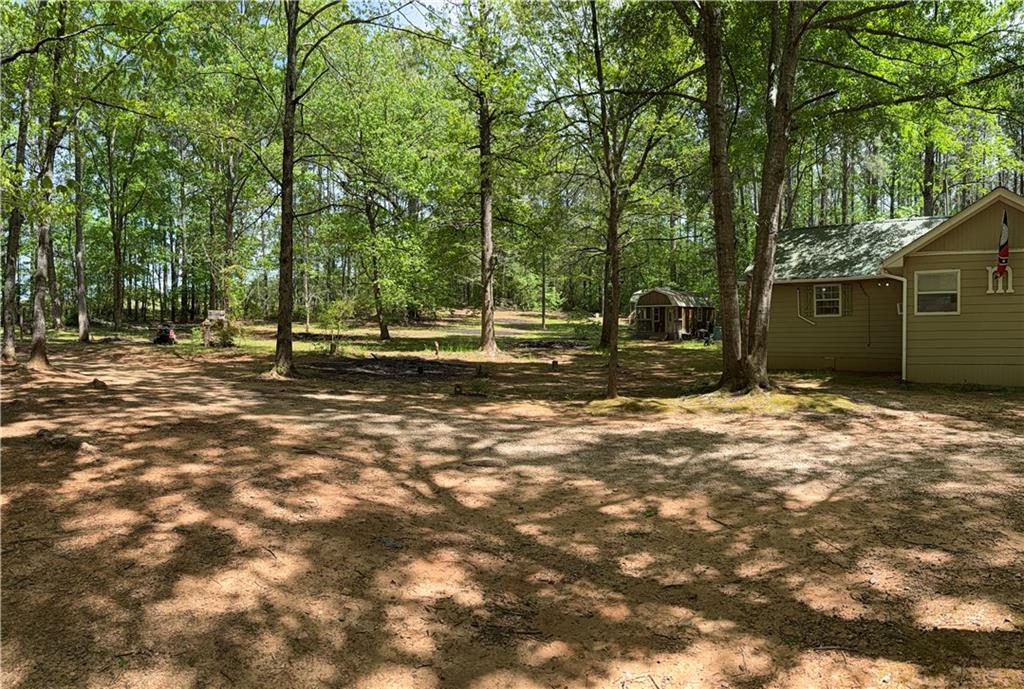 27 Hawks Trail Newborn, GA 30056 - Photo 21 of 33 a backyard of a house with lots of green space