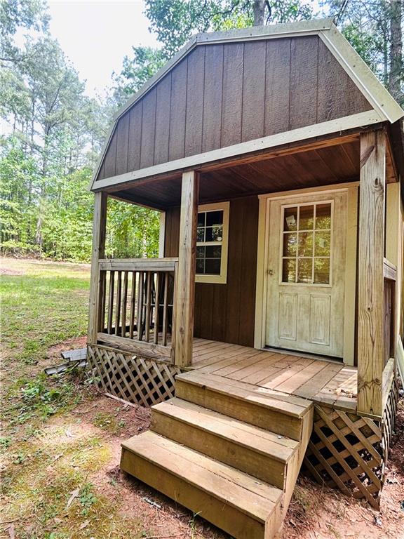 27 Hawks Trail Newborn, GA 30056 - Photo 5 of 33 a view of a house with backyard and porch