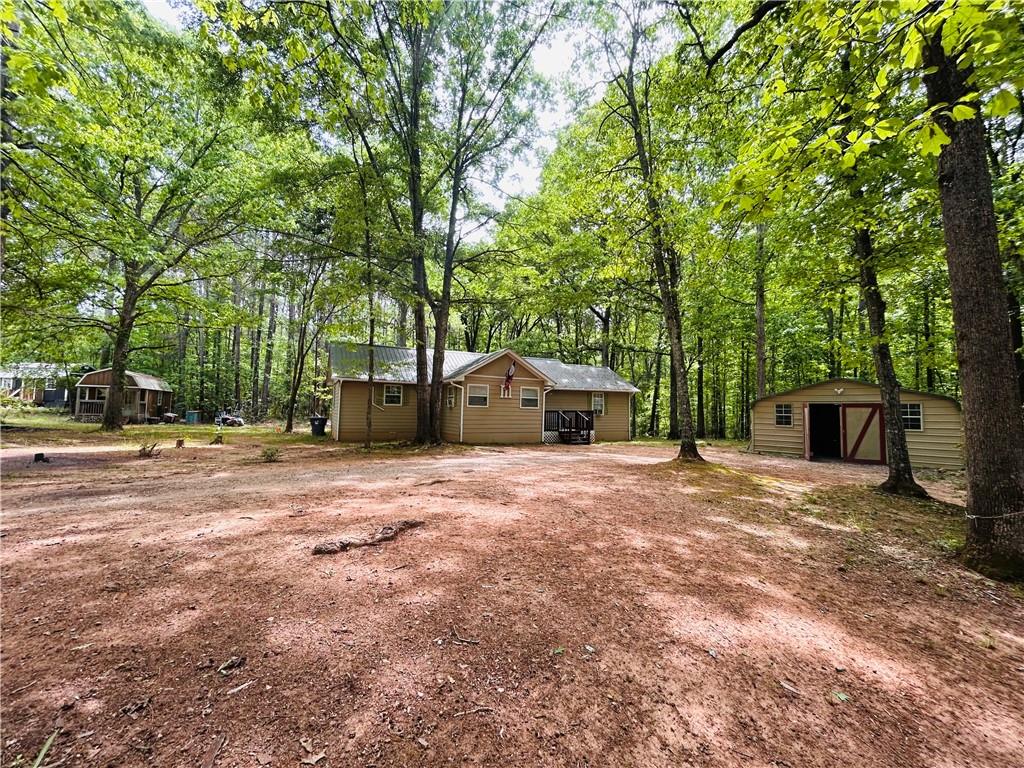 27 Hawks Trail Newborn, GA 30056 - Photo 6 of 33 a front view of a house with a yard and tree