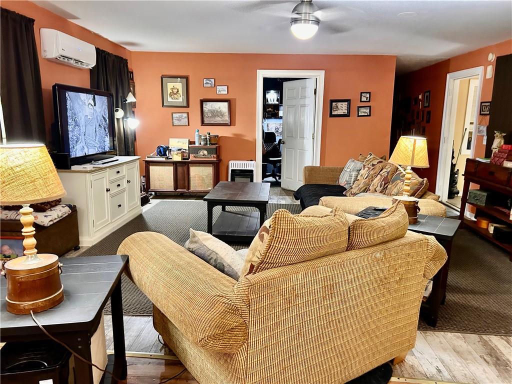 27 Hawks Trail Newborn, GA 30056 - Photo 7 of 33 a living room with furniture fireplace and a flat screen tv
