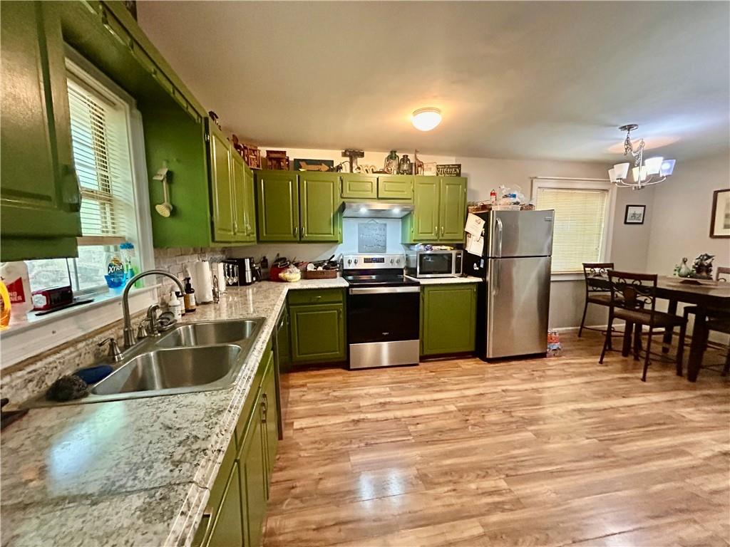 27 Hawks Trail Newborn, GA 30056 - Photo 10 of 33 a kitchen with kitchen island granite countertop a sink counter and chairs
