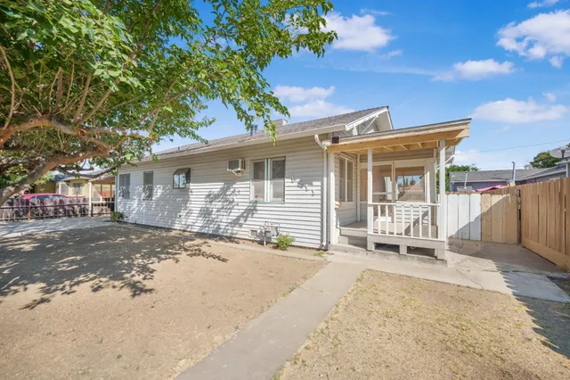 a front view of a house with a patio