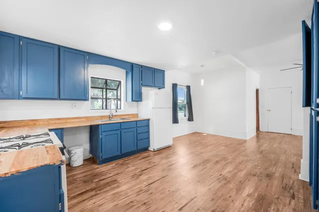 a kitchen with stainless steel appliances granite countertop a sink and cabinets