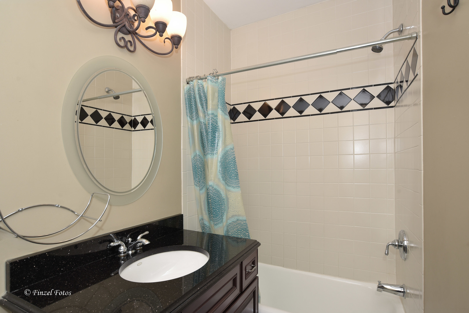 331 Griswold Street Elgin, IL 60123 - Photo 11 of 36 a bathroom with a sink and a mirror
