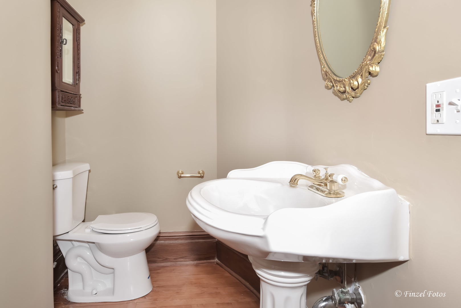 331 Griswold Street Elgin, IL 60123 - Photo 12 of 36 a bathroom with a sink and a toilet