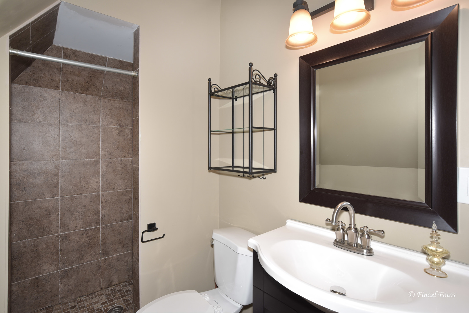 331 Griswold Street Elgin, IL 60123 - Photo 17 of 36 a bathroom with a sink toilet and mirror