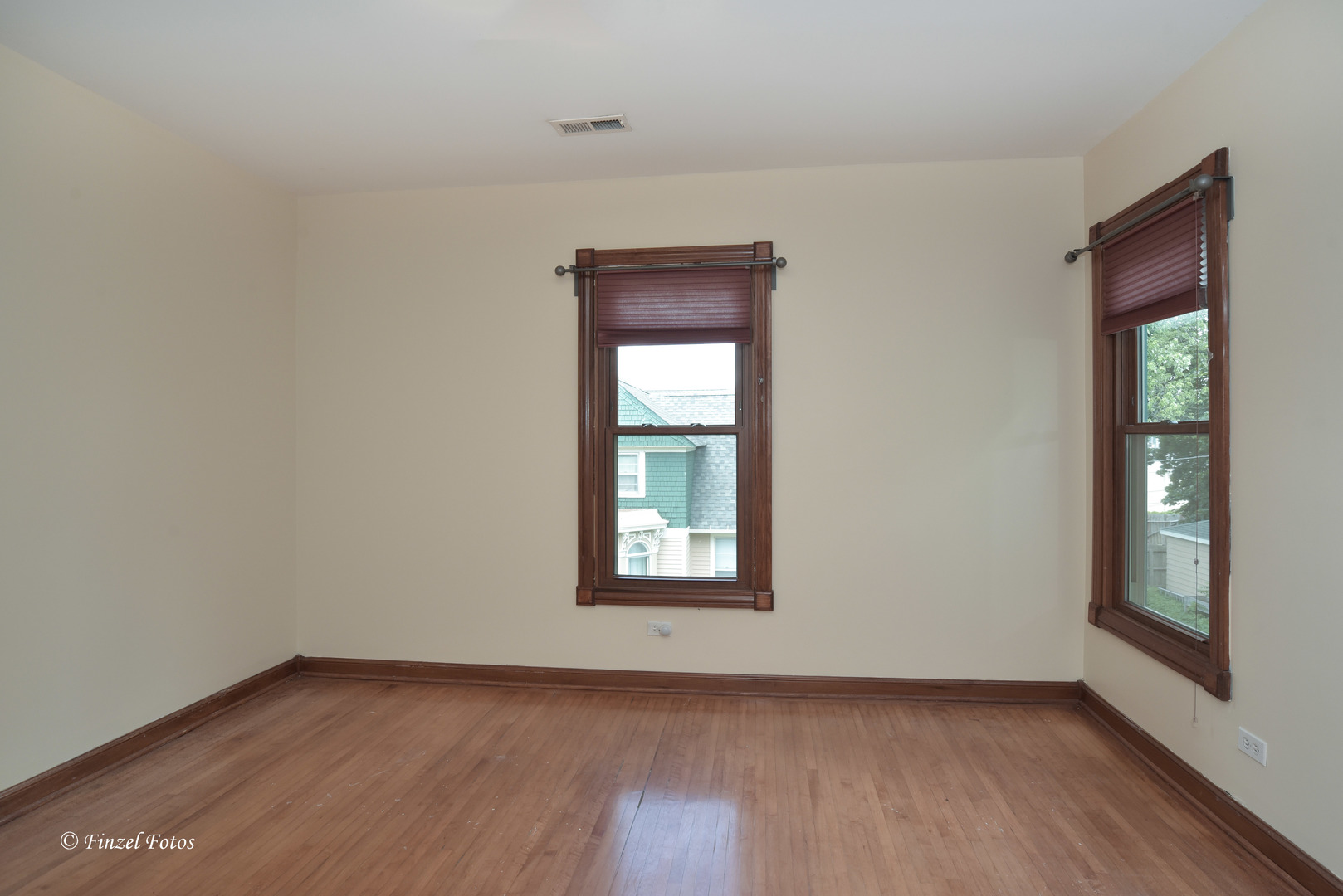 331 Griswold Street Elgin, IL 60123 - Photo 20 of 36 a view of an empty room with wooden floor and a window