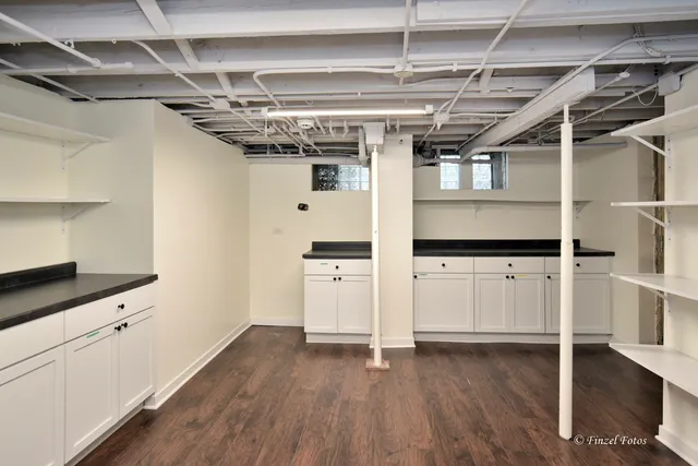 a view of storage and utility room with wooden floor