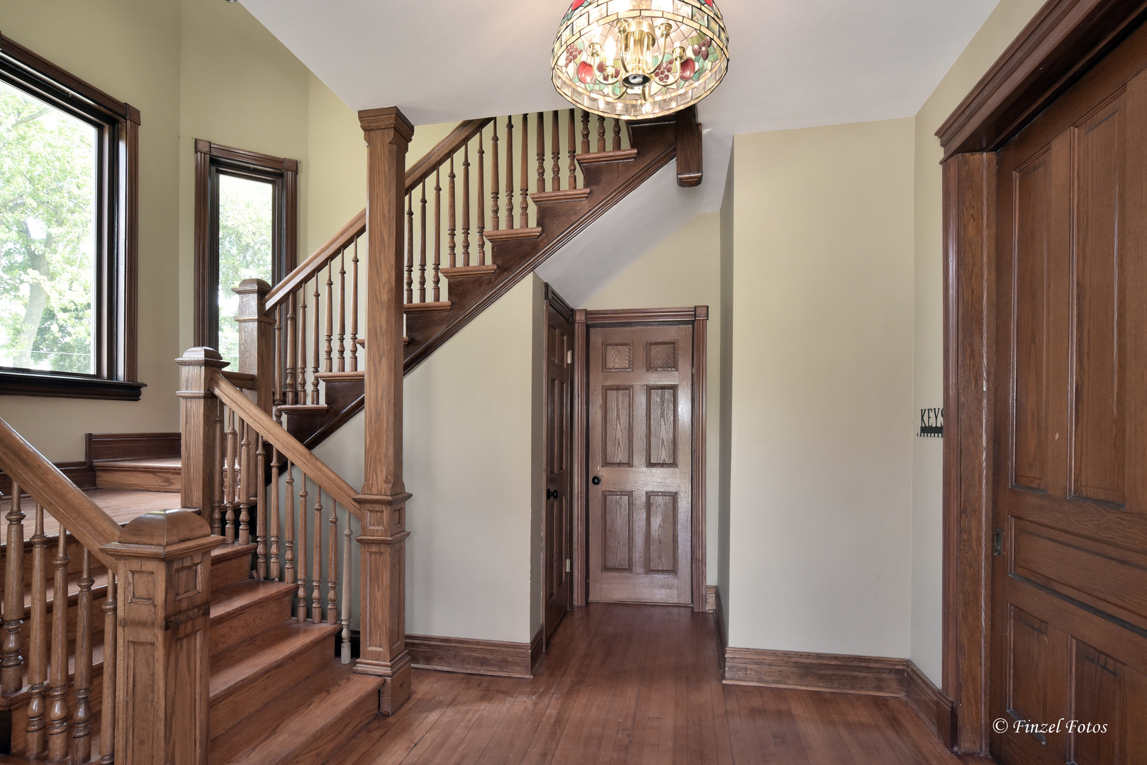 331 Griswold Street Elgin, IL 60123 - Photo 3 of 36 a view of entryway with wooden floor and stairs