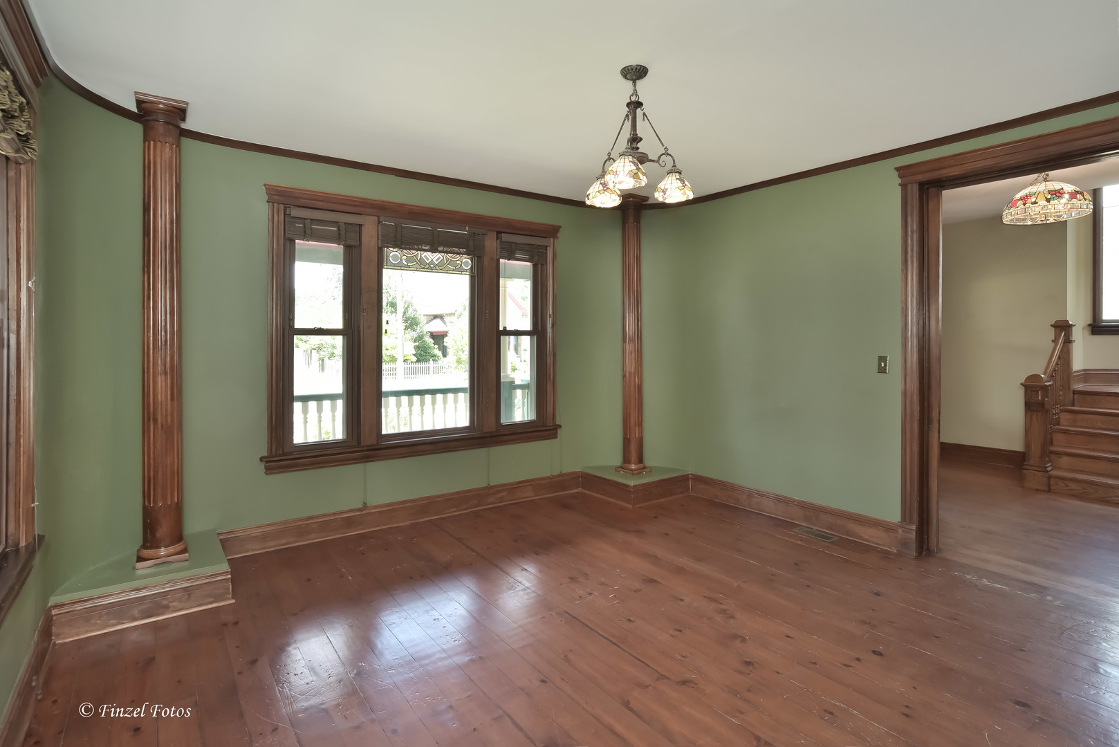 331 Griswold Street Elgin, IL 60123 - Photo 5 of 36 wooden floor in an empty room with a window