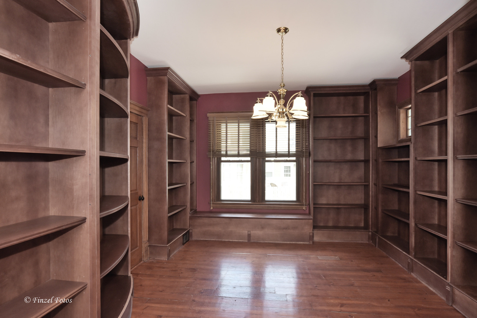 331 Griswold Street Elgin, IL 60123 - Photo 6 of 36 a view of an empty room with a window and wooden floor