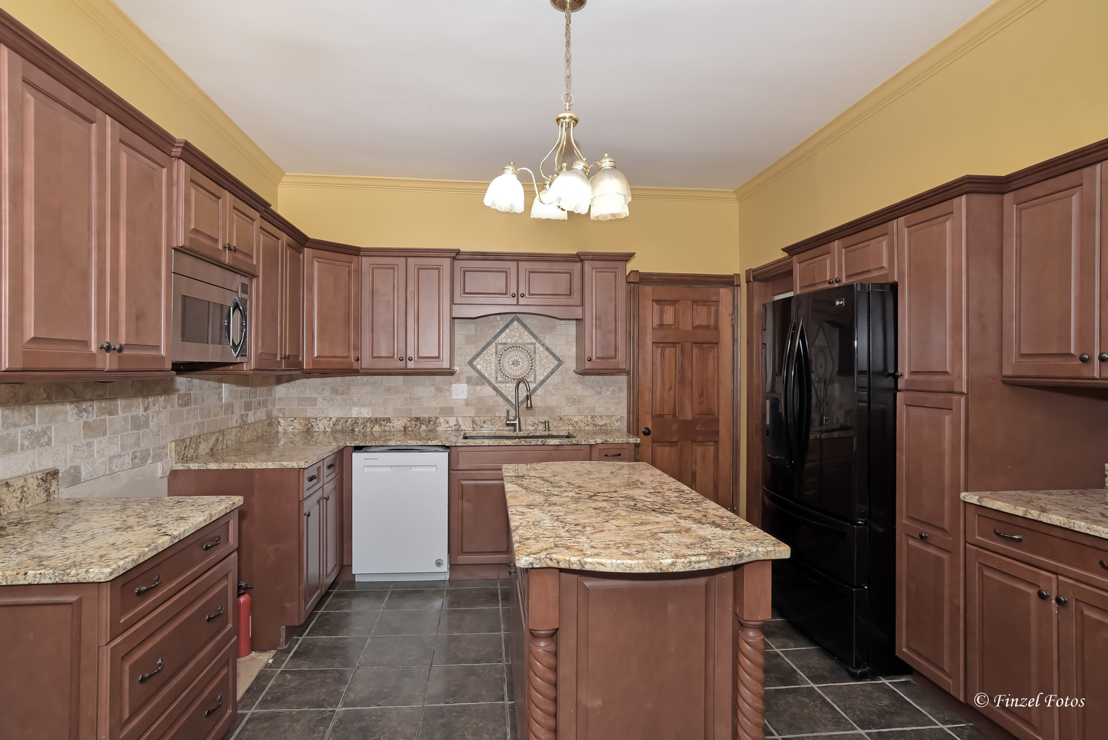 331 Griswold Street Elgin, IL 60123 - Photo 9 of 36 a kitchen with a sink stove and refrigerator