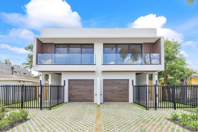 a front view of a house with a garage