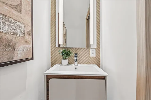 a kitchen with stainless steel appliances kitchen island a stove and a refrigerator